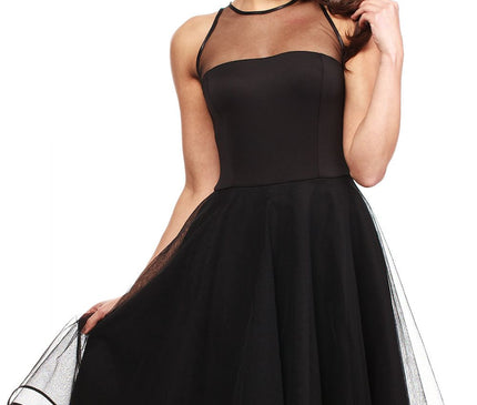 Female model in a black sleeveless fit-and-flare mesh panel midi dress holding the skirt out against a white background