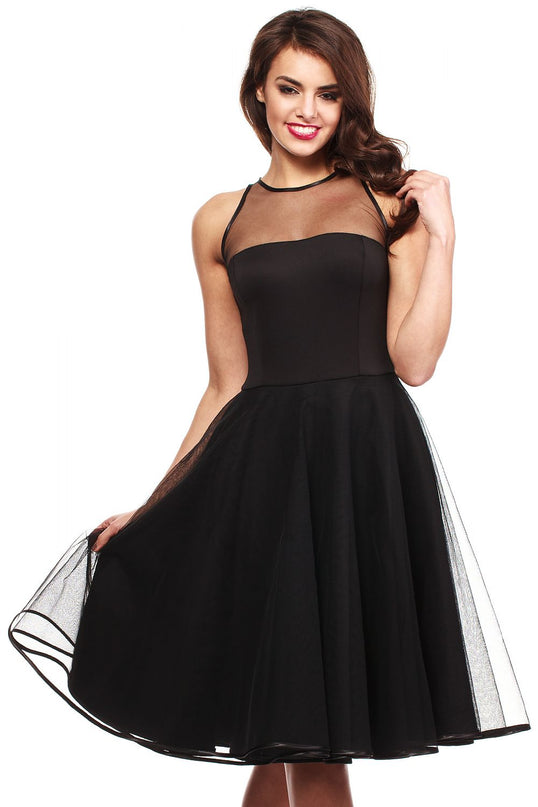 Female model in a black sleeveless fit-and-flare mesh panel midi dress holding the skirt out against a white background