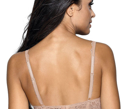Model with her back facing the camera and head in profile wearing a nude lace demi bra with adjustable straps against a white background