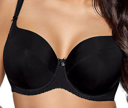 Female model wearing a black smooth microfiber underwired full coverage bra stands against a plain white background with hands clasped at her midriff