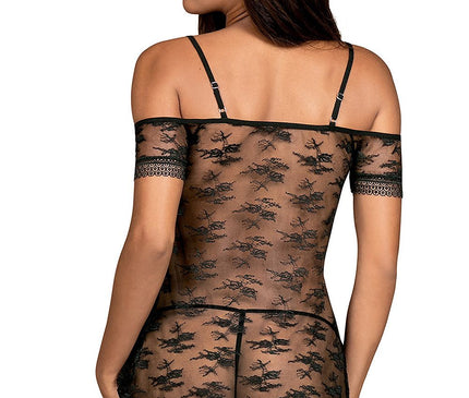 A female model poses with her back to the camera wearing a sheer black lace off-the-shoulder mini babydoll against a plain white background