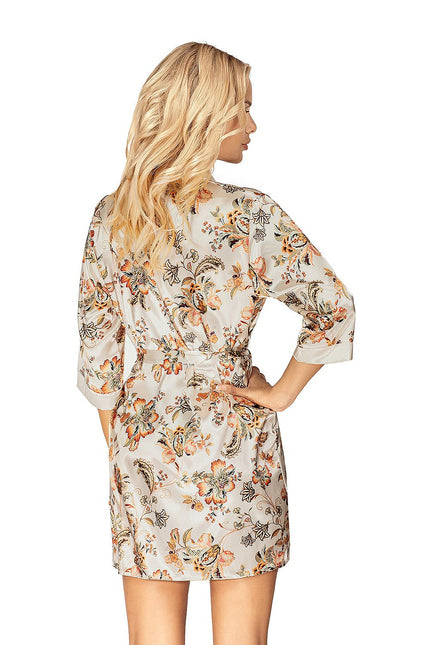 Female model in a short cream satin floral print robe with three-quarter sleeves standing with hands on hips against a white background