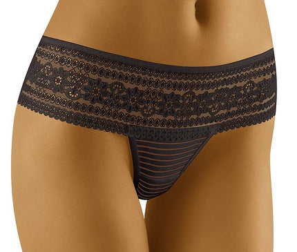A model stands against a plain white background wearing a black lace low-rise thong with a striped mesh front panel