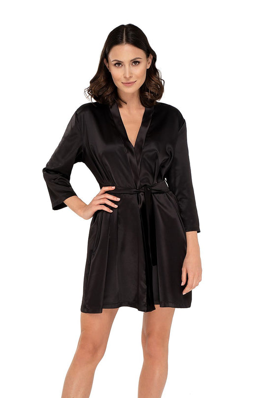 Female model wearing a short black satin wrap robe with three-quarter sleeves standing with one hand on hip against a plain white background