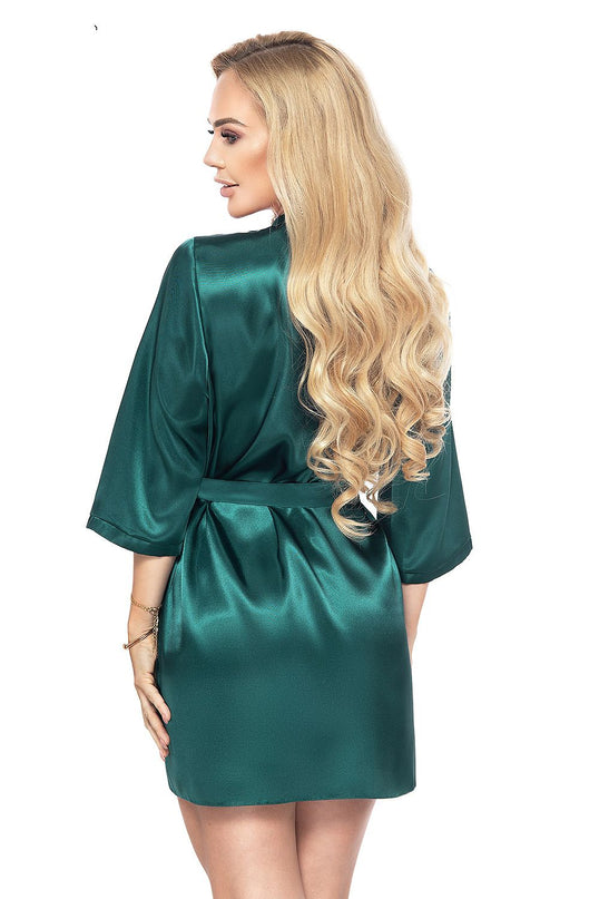 Model wearing an emerald green satin wrap robe with three-quarter sleeves standing back to the camera with her head turned to the side against a plain white background