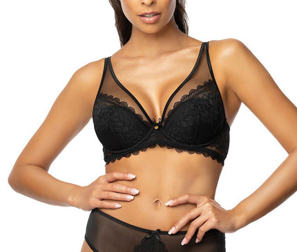 Female model wearing a black lace and mesh plunge bra with matching high-rise briefs stands front-facing with hands on hips against a plain white background