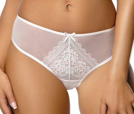A female model stands against a plain white background wearing mid-rise white mesh and lace briefs with a triangular floral lace front panel and her hands resting by her sides