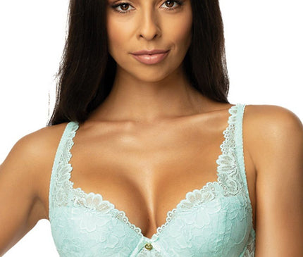 Model facing forward wearing a mint green lace balconette bra against a white background