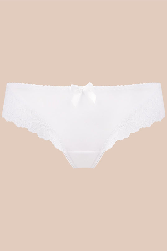 White low-rise lace-trimmed bikini briefs in smooth fabric displayed flat on a beige background