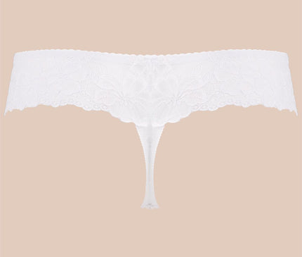 White lace thong with scalloped waistband and minimal cut shown in a flat lay against a plain beige background